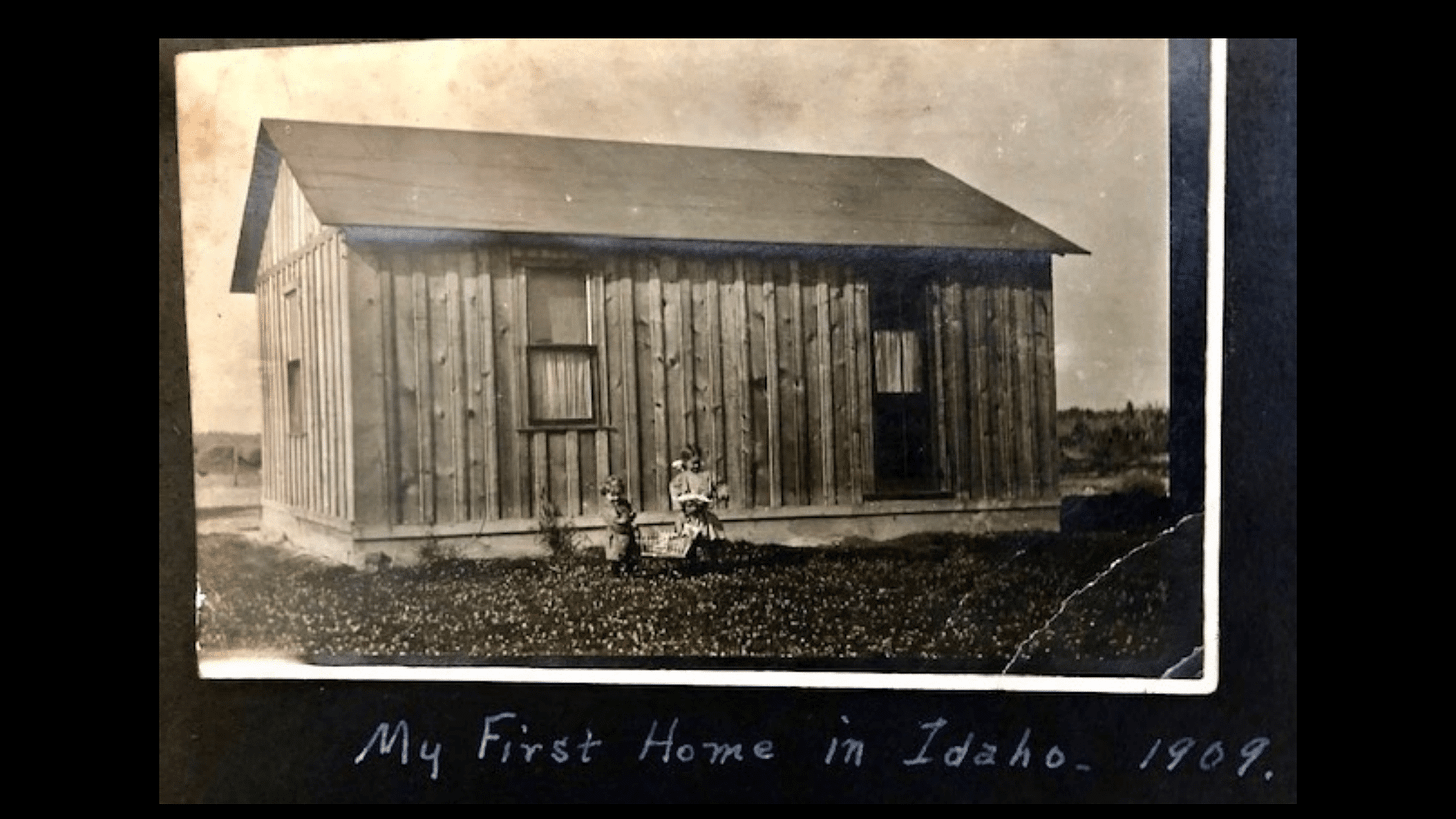 Composer Jeff Beal's great grandmother lived in this paper lined shack. The handwritten text below says, "My first home in Idaho. 1909."