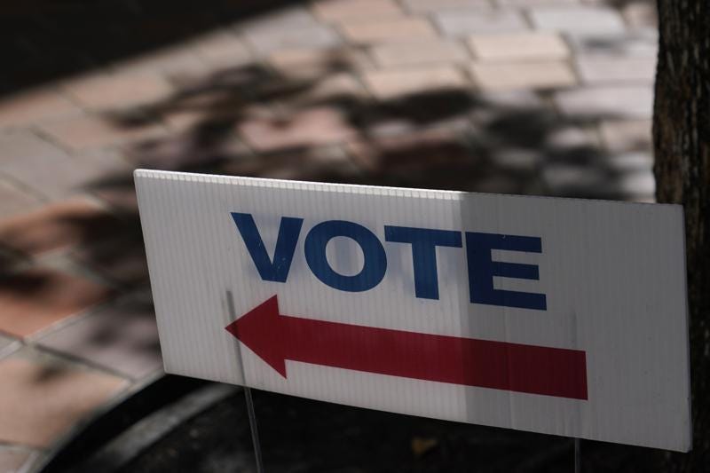 FILE - A sign that says "Vote" is placed outside of an early voting location Oct. 31, 2022, in Miami. Midterm elections are behind held on Nov. 8. (AP Photo/Lynne Sladky, File)