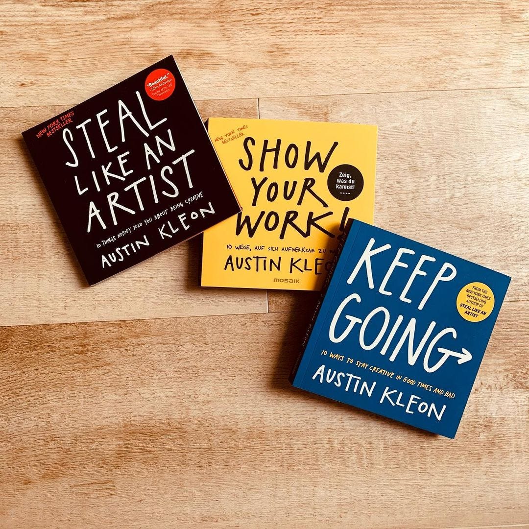 a photo of my books, steal like an artist, show your work, and keep going