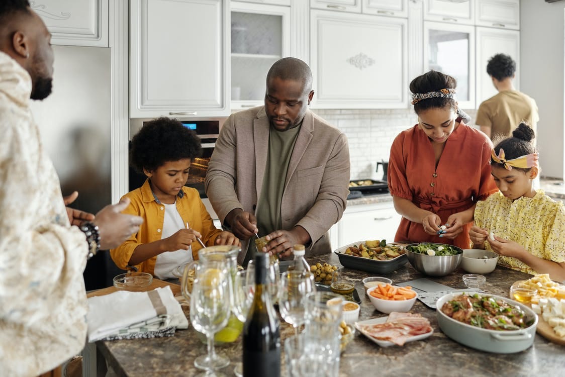 Free Family Preparing Food in the Kitchen Stock Photo