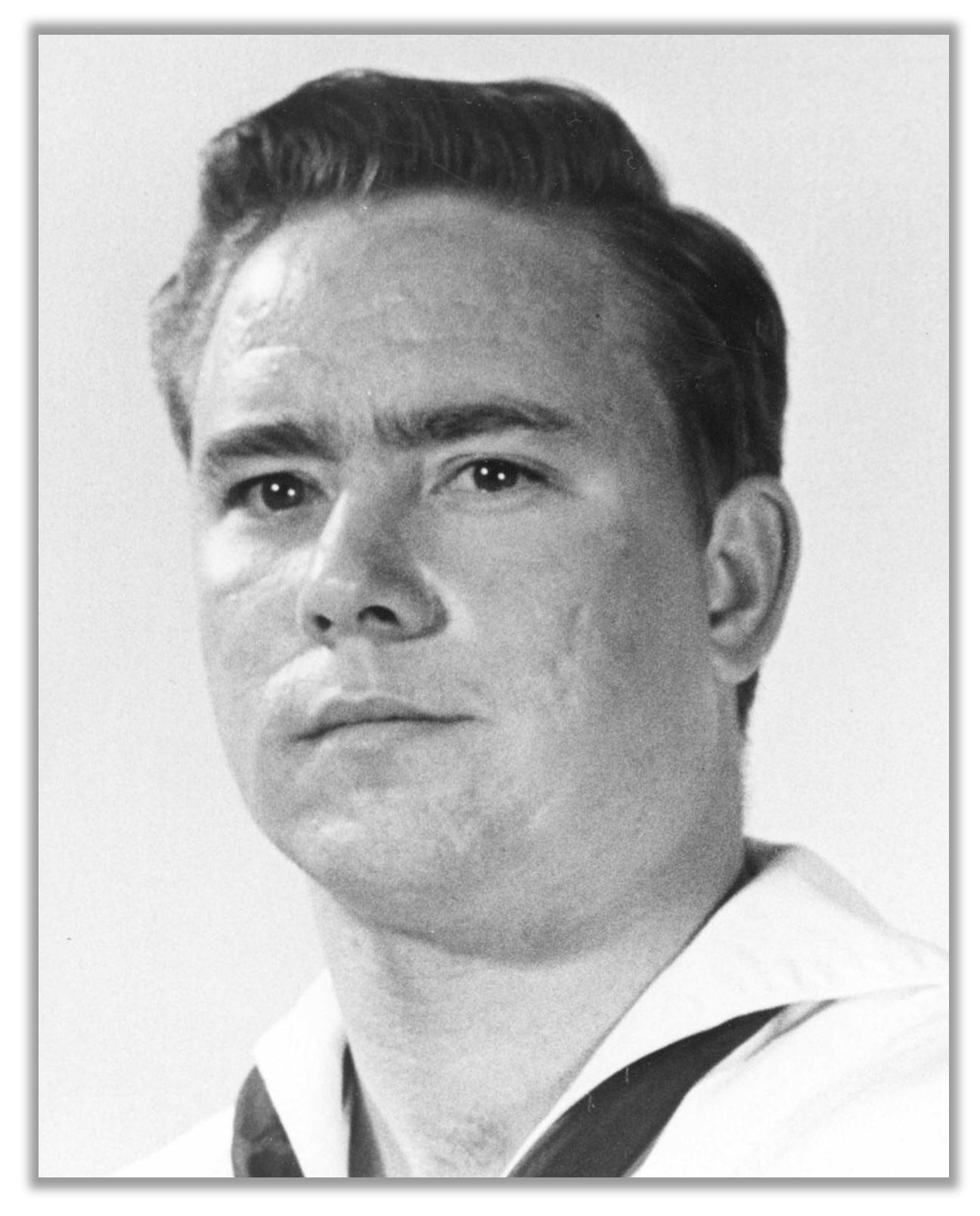 Headshot of Donald Ballard in a sailor's uniform.