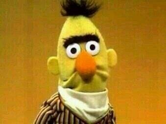 Bert from Sesame Street frowning, with his mouth.