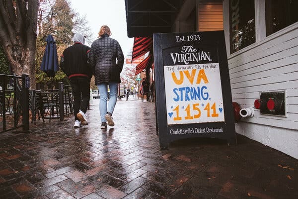 Local businesses surrounding the University of Virginia put up signs in support of the school this week. 