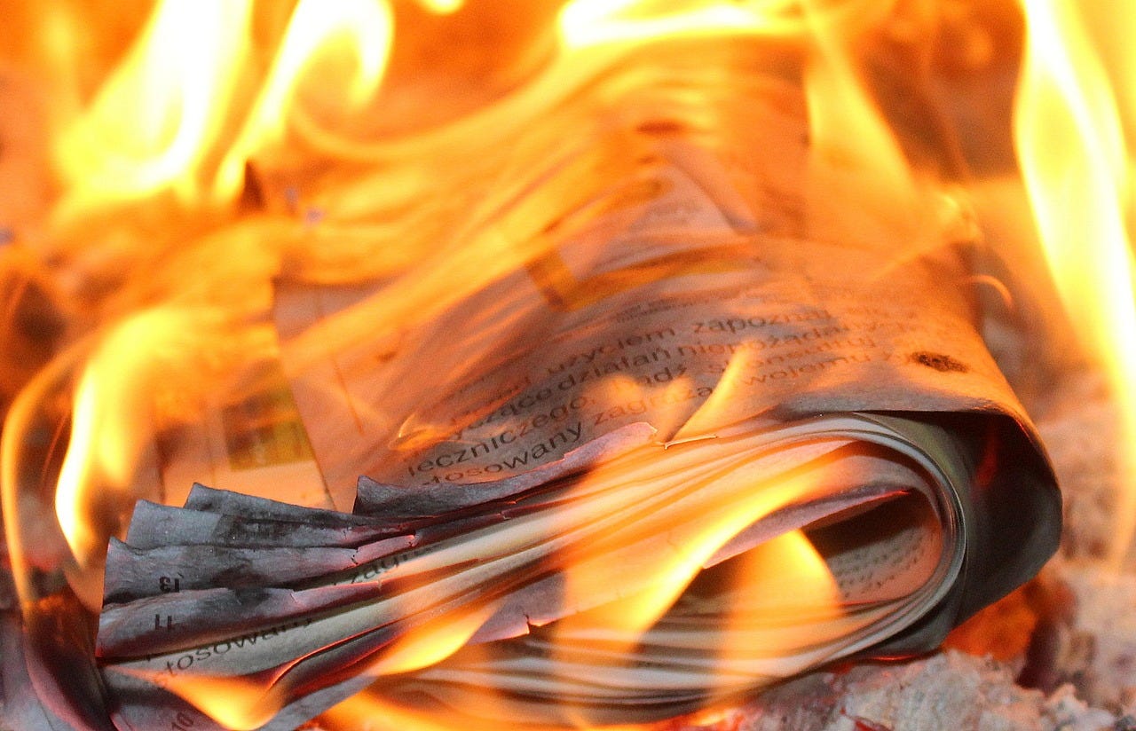A newspaper on fire