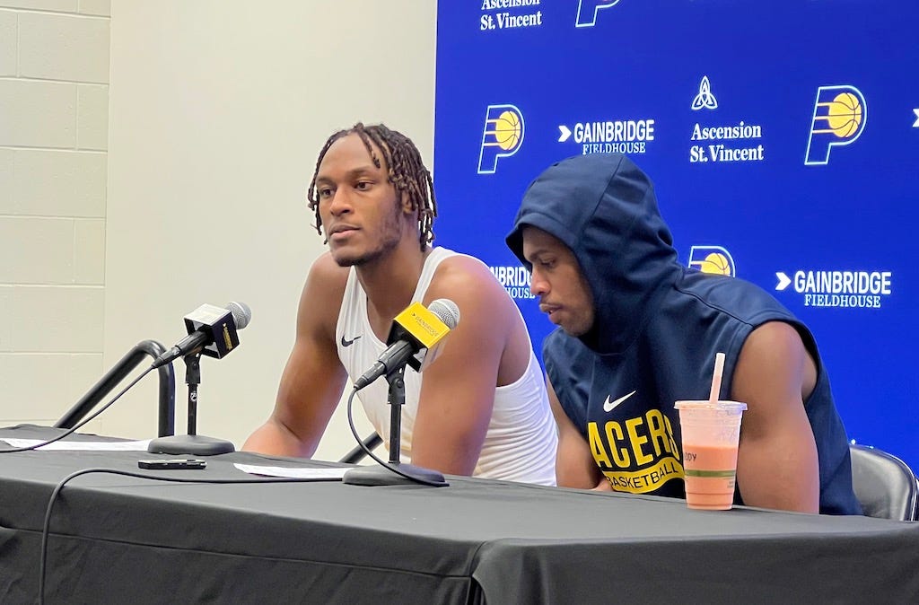 Myles Turner and Buddy Hield at the podium after they combined to score 49 points in the Pacers’ victory over the Brooklyn Nets.