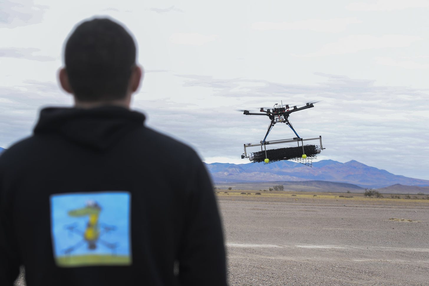U.S. Air Force 2nd Lt. David Feibus, from Wright-Patterson Air Force Base, Ohio, fly's one his teams DJI S1000 drone during the setup and calibration phase of the event at the Nevada National Security Site, Las Vegas, NV., Dec. 9, 2016. This year teams were given the challenge of solving issues revolving around drones, and are demonstrating their solutions to judges. 