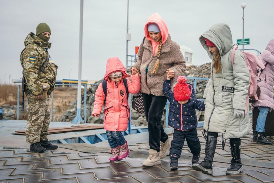 Ukrainian Women and Children Flee Across Border to Romania