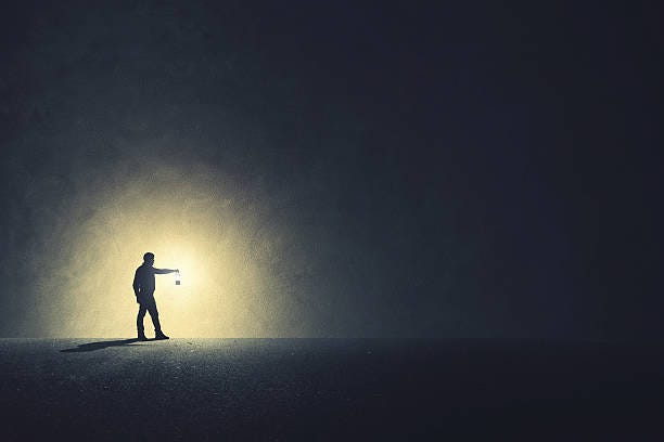 Man with lamp walking illuminating his path Man with lamp walking illuminating his path Discovery stock pictures, royalty-free photos & images
