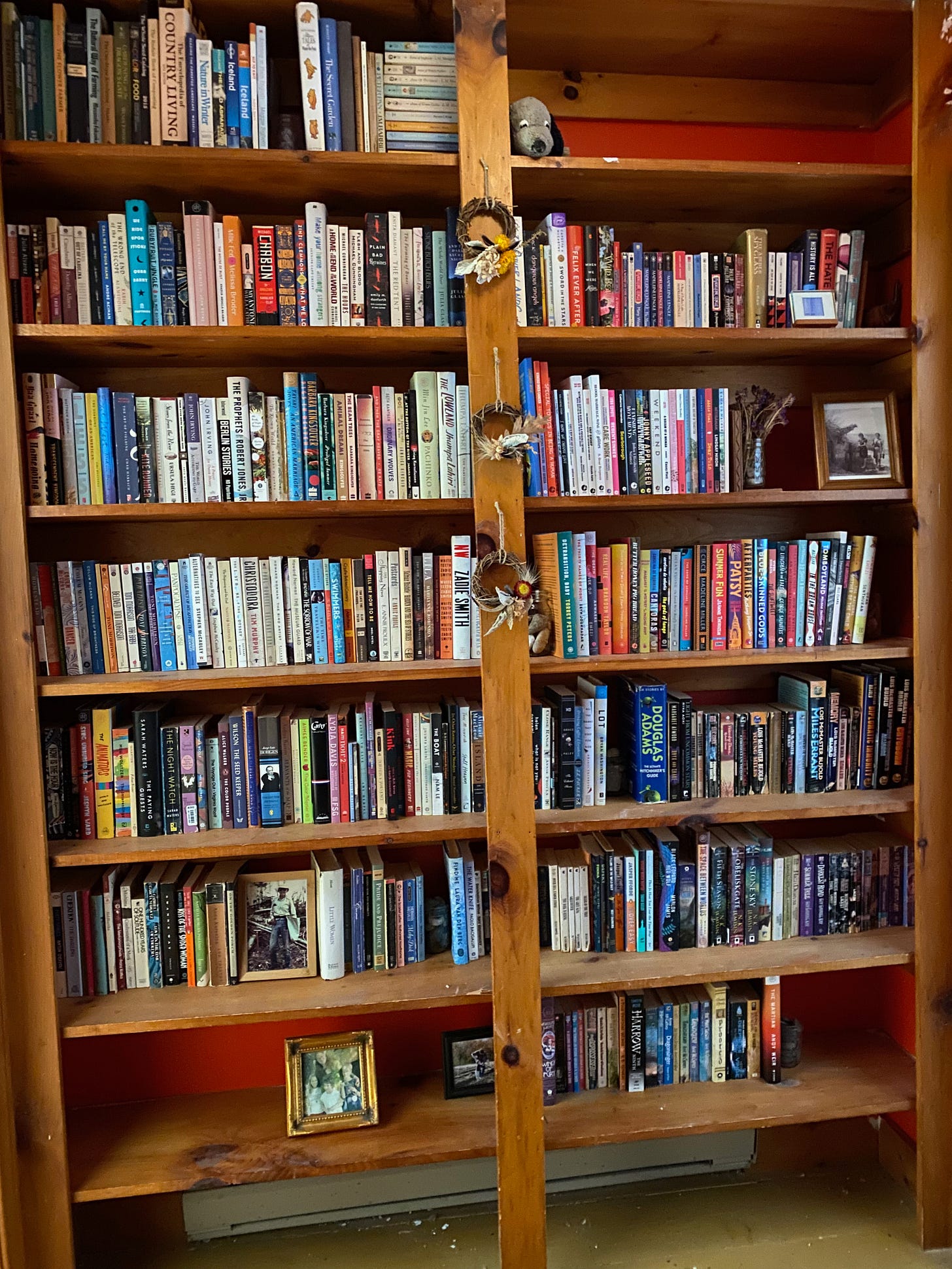 Two tall built-in bookshelves filled with books.