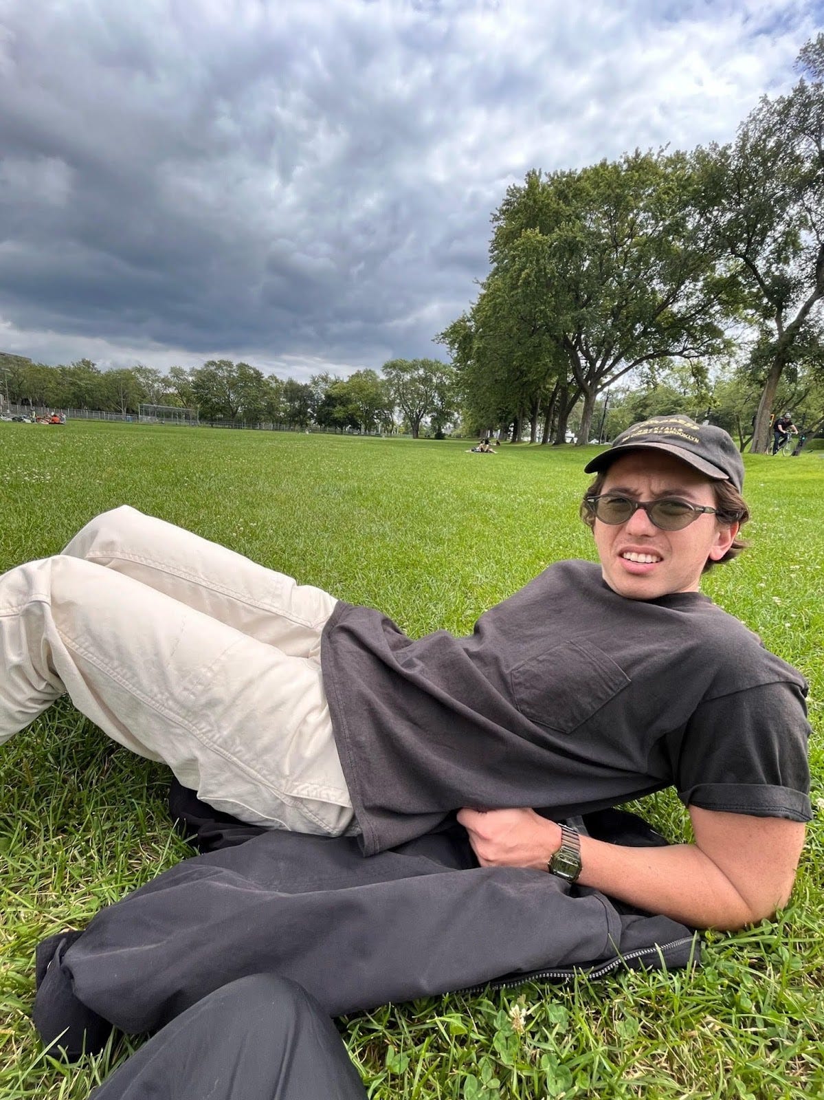 Max Tani reclining in park