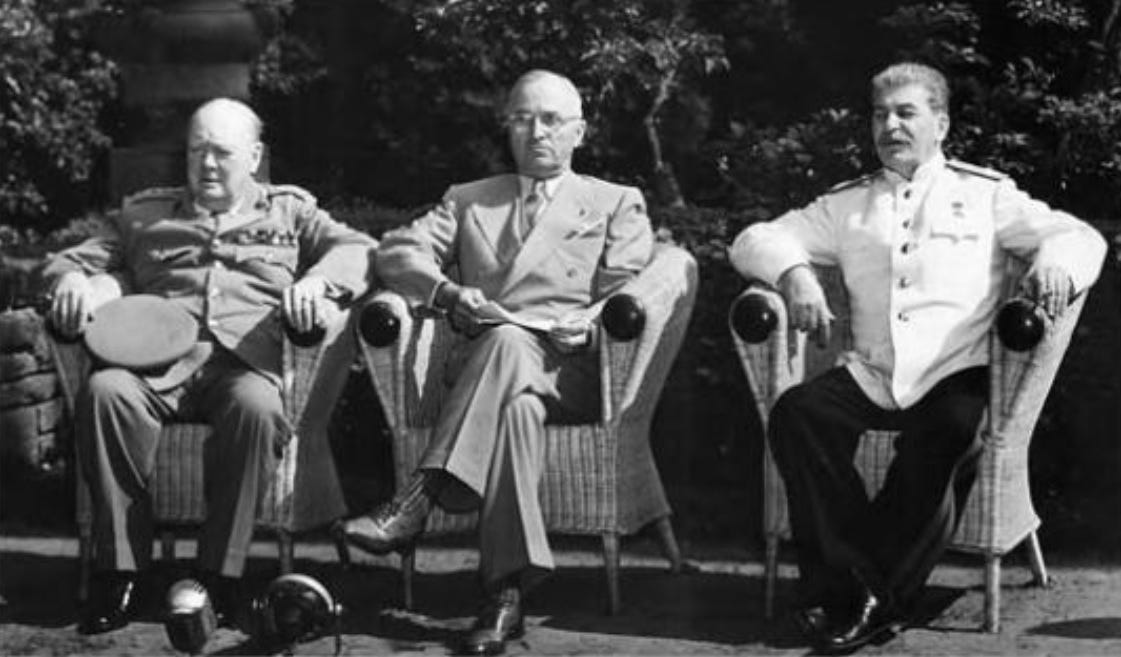 Churchill, Truman, and Stalin pose together at the Potsdam Conference.