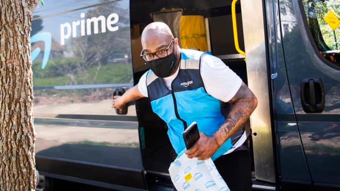 Amazon driver Shawndu Stackhouse delivers packages in Northeast Washington, D.C., on Tuesday, April 6, 2021.