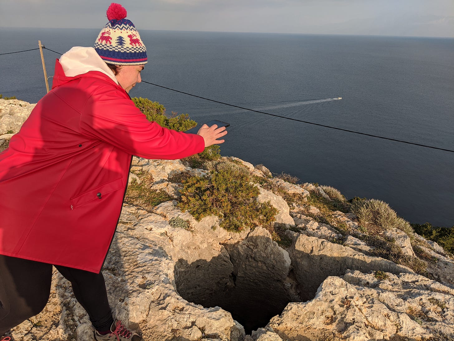 Petra Hermankova in the field using the FAIMS module to record an underground water cistern on the top the Perachora Acropolis, January 2020