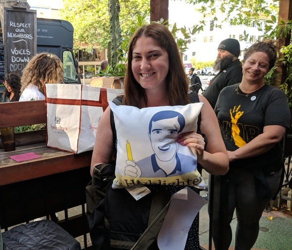 Loyal subscriber Michele won a Highlighter pillow, the grand prize at HHH #6. Loyal subscriber Laura (right) is jealous. (So is the bouncer in the back.)