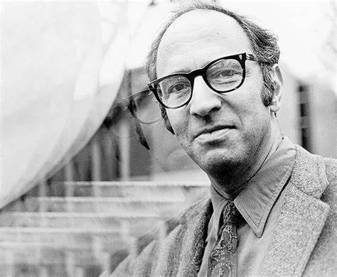 A black and white portrait of Thomas Kuhn, philosopher of science.