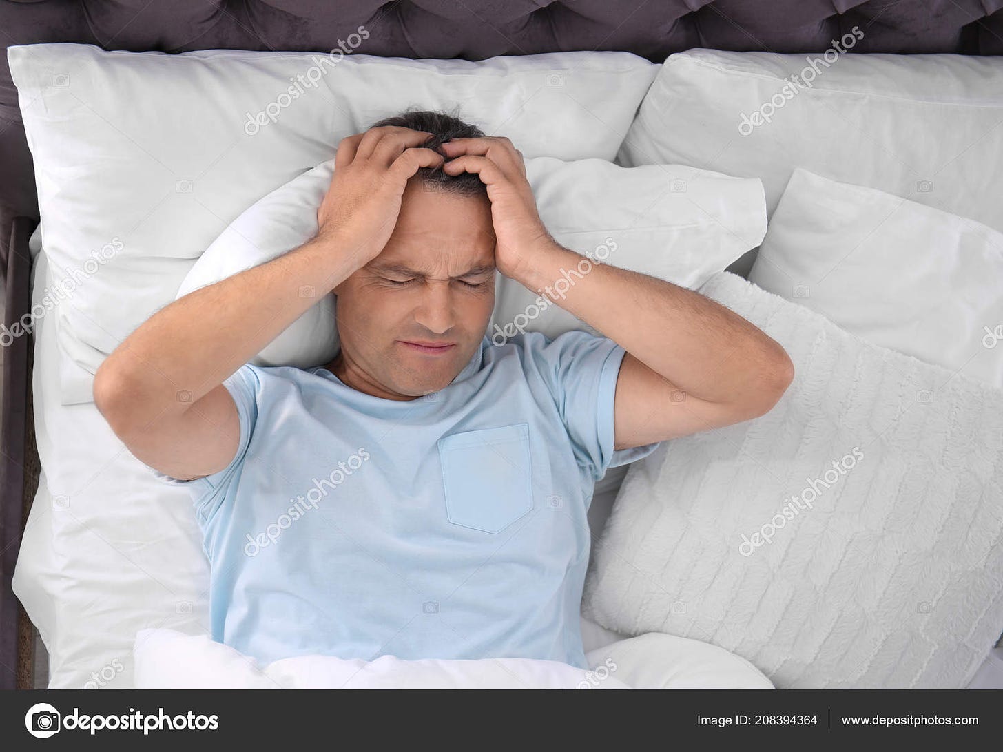 Man Suffering Headache Sleep Bed Uncomfortable Pillow Stock Photo by  ©NewAfrica 208394364