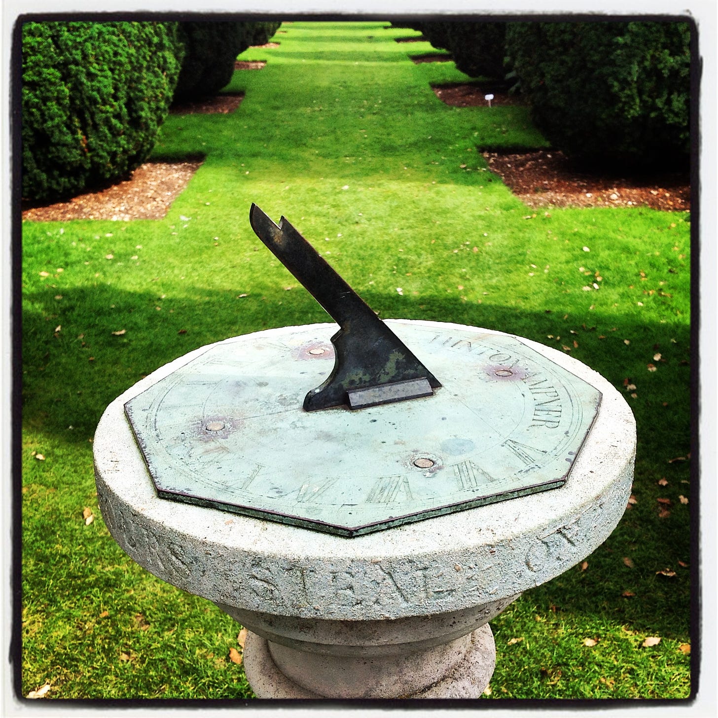 sundial in formal gardens