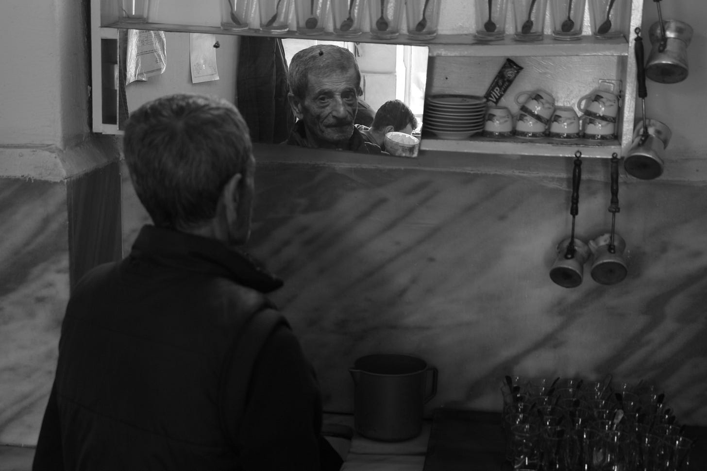 image of an old man looking at his reflection in a mirror for article by Larry G. Maguire