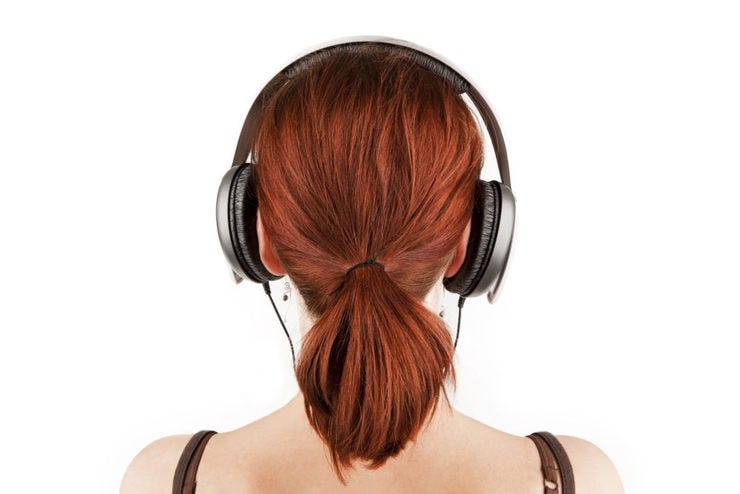 Headphones woman shutterstock 1024x683
