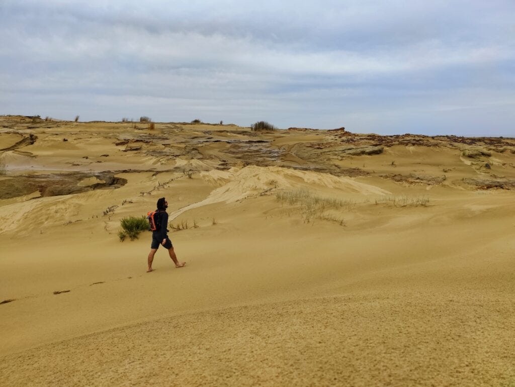 Dunc hikes barefoot throigh part of Te Paki giant sand dunes