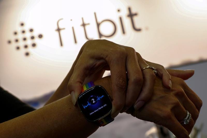 Google closes Fitbit deal as U.S., Australia probes continue | Reuters