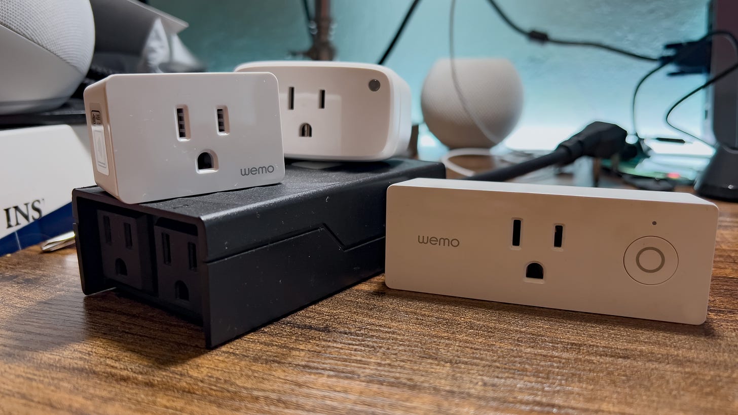 A group of smart plugs on a desk