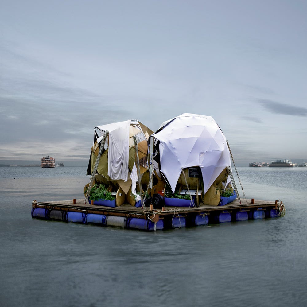 Mattingly's floating sculptural home is a square raft with two small yurt-like structures, an assemblage of wood and weather-proof fabrics.