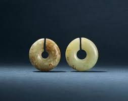 TWO JADE EAR ORNAMENTS, JUE | XINGLONGWA CULTURE, CIRCA 6200-5400 BC | jade/jadeite,  China | Christie's