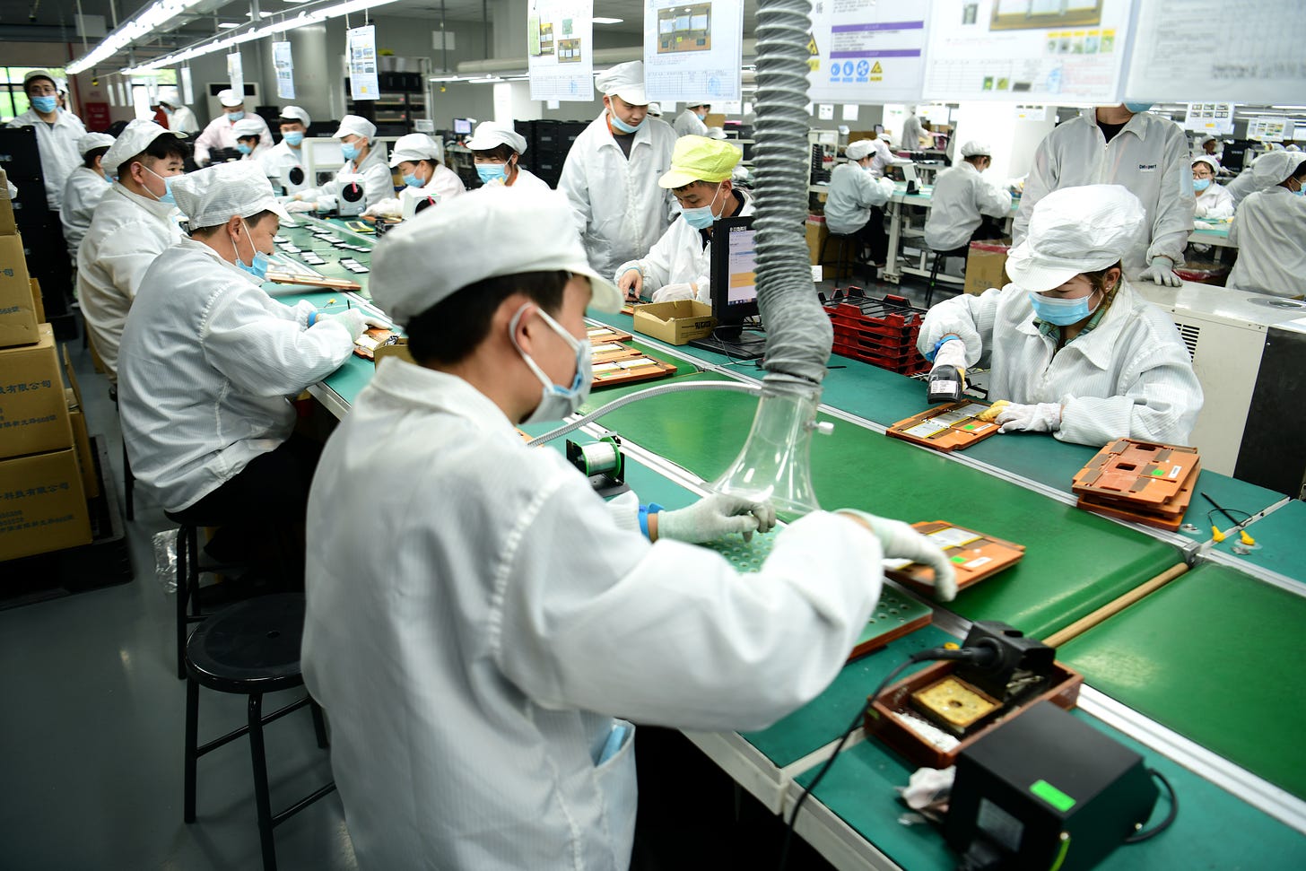 Workers rush to make orders for lithium battery products at workshop in Nantong, Jiangsu province, March 14, 2022. (Costfoto/Future Publishing via Getty Images)