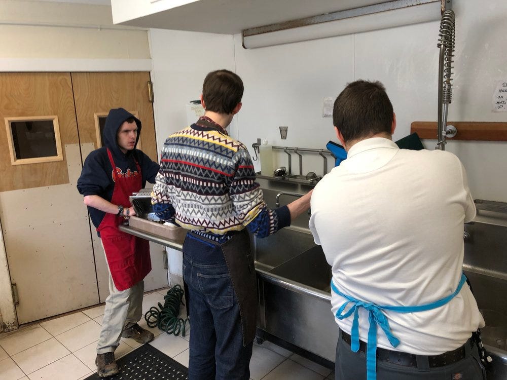 Dustin Sweeney working with Marcus and Andy in the kitchen at The Fellowship, a Senior Living Facility on the Otto Specht/Threefold campus
