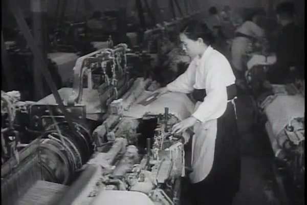 Women work in a factory manufacturing clothes in South Korea in the 1960s.  - Stock Video Footage - Dissolve