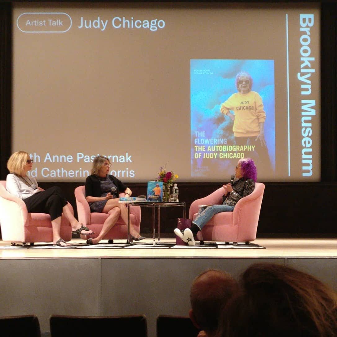 Photo of Judy Chicago being interviewed by Anne Pasternak and Catherine Morris at the Brooklyn Museum