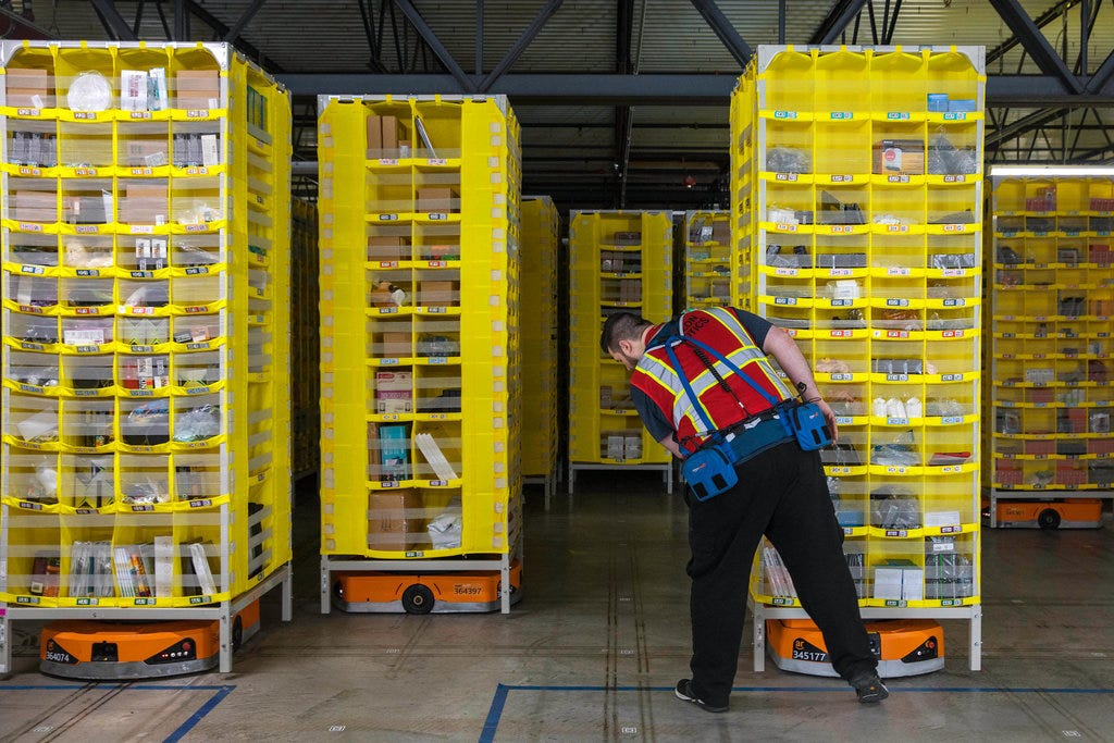 Inside an Amazon Warehouse, Robots' Ways Rub Off on Humans - The New York  Times