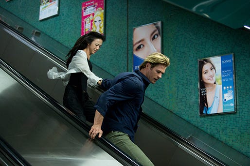Lien Chen (Wei Tang) and Nicholas Hathaway flee after a violent attack from nefarious hackers in Universal Pictures' techno-thriller "Blackhat," directed by Michael Mann.