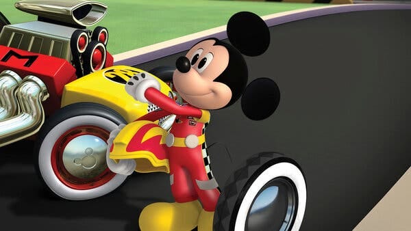 Mickey Mouse dressed as a race car driver.