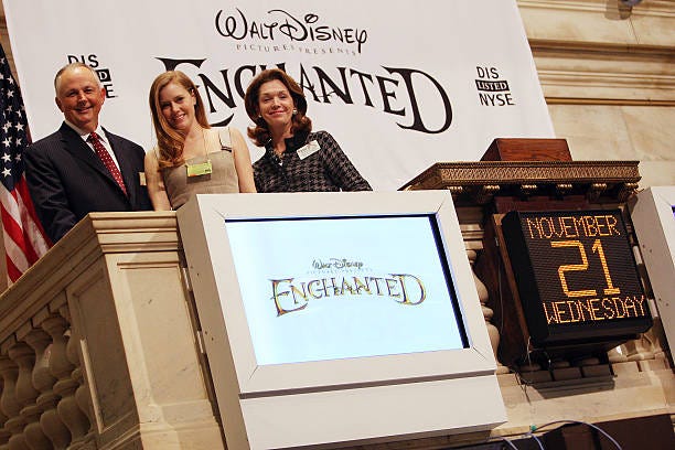 Chairman of the Walt Disney Studios Richard Cook, actress Amy Adams, and NYSE Executive Vice President Noreen Culhane ring the closing bell on the...
