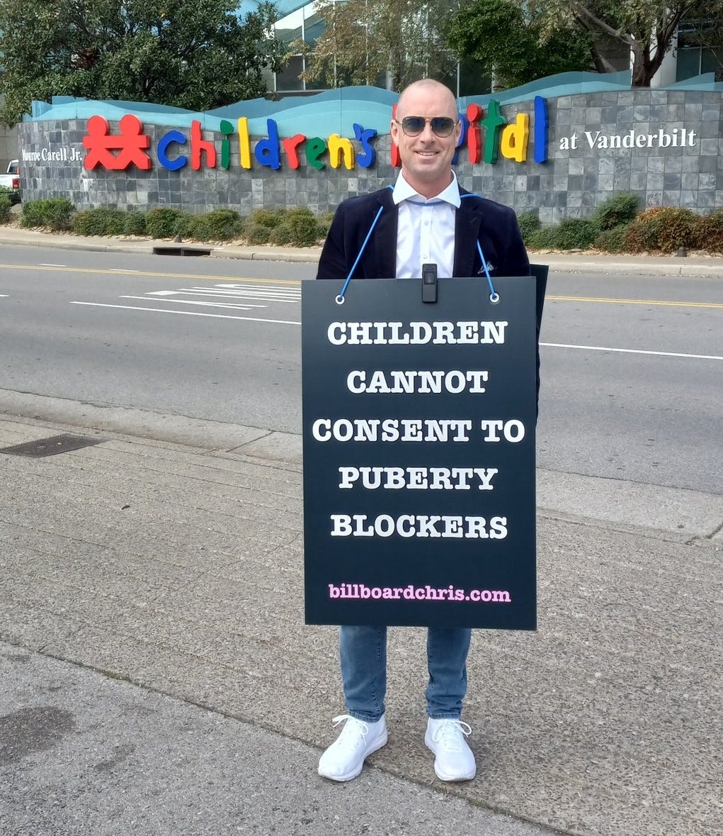 "Children cannot consent to puberty blockers." Chris wears his sign in front of the Vanderbilt Children's Hospital that recently announced they have stopped doing the transgender surgeries on minors that advocates of transition still insist do not exist