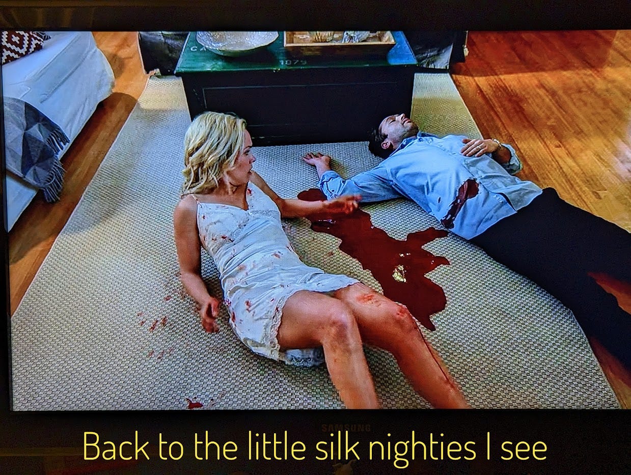 Nancy waking up next to Luke, who is dead from all the blood that has leaked out of his gut. Captioned "Back to the little silk nighties I see"