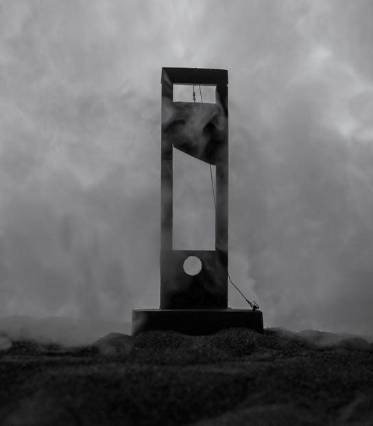 guillotine in mist