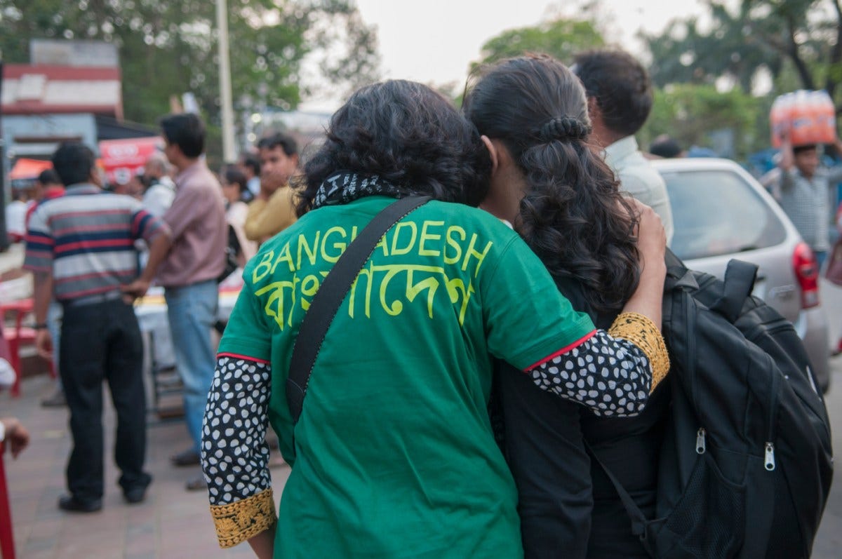Convicts who killed atheist author and publisher escape custody in Bangladesh | People hugging each other during a rally to condemn the killing of Bangladeshi blogger Avijit Roy by radical Islamist groups in Kolkata, India