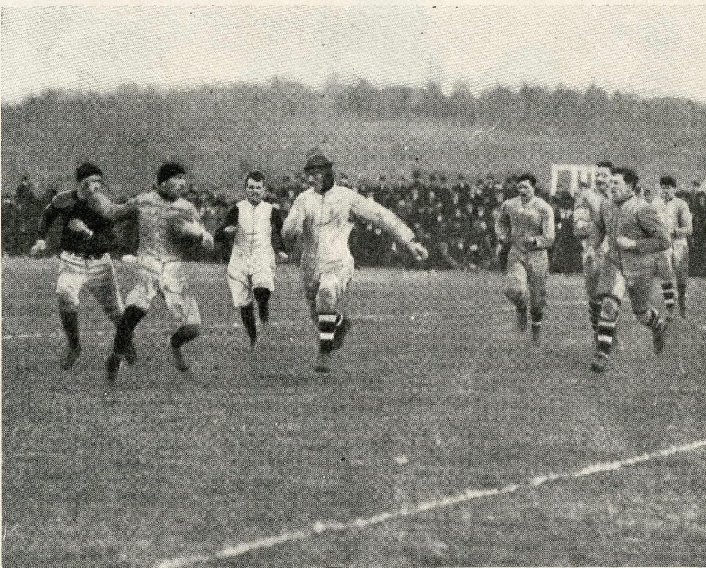 A Hamilton runner evades the Ottawa defense (striped socks) without the benefit of blockers.