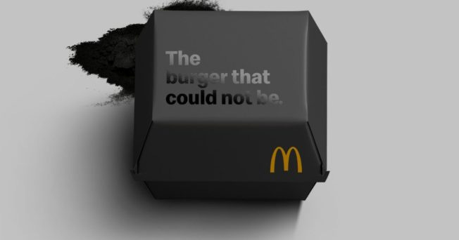 a charred mcdonald's burger box that says 