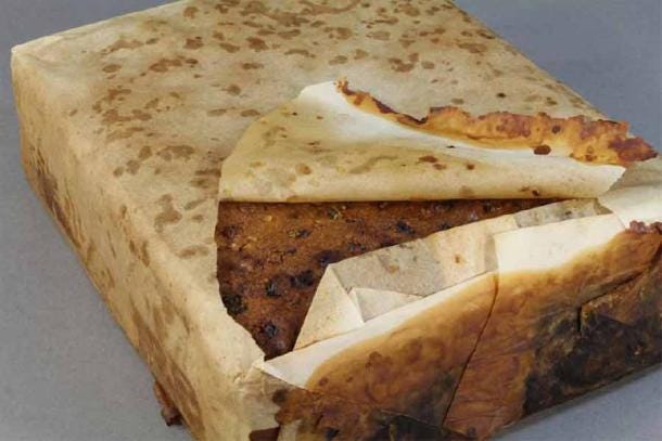 100-year-old fruitcake found amongst almost 1,500 artifacts conserved from a group of buildings at Cape Adare in the Antarctic. It was probably left behind by Scott’s Terra Nova expedition. (Antarctic Heritage Trust)