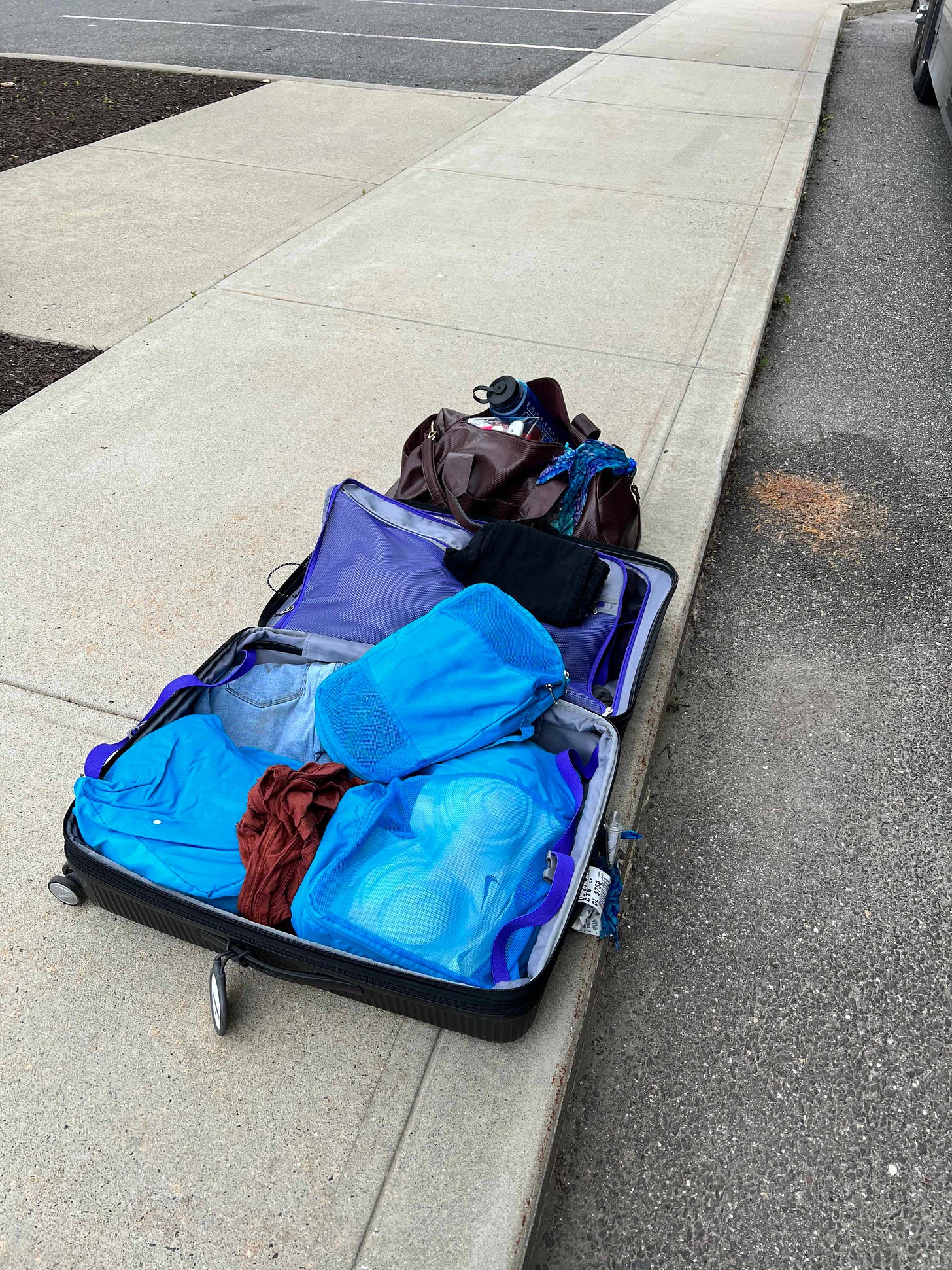 Sidewalk suitcase organization