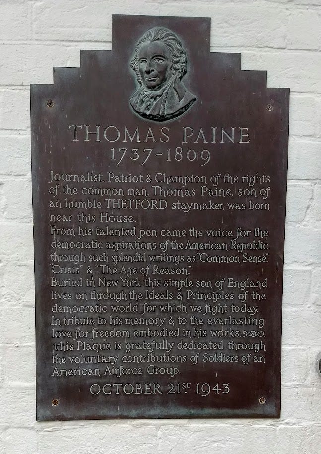Plaque dedicated to Tom Paine with relief