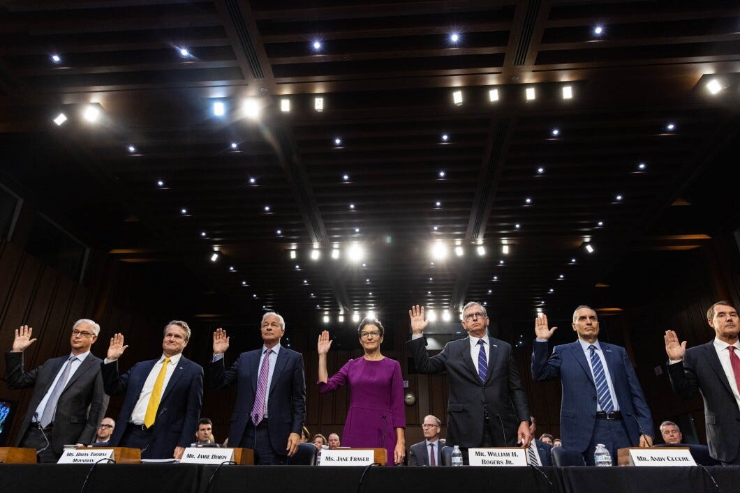 From left, Charles Scharf, CEO of Wells Fargo, Brian Moynihan, CEO of Bank of America, Jamie Dimon, CEO of JPMorgan Chase, Jane Fraser, CEO of Citigroup, William Rogers Jr., CEO of Truist, Andy Cecere, CEO of U.S. Bancorp, and William Demchak, CEO of PNC Financial Services, are sworn in during a Senate Banking, Housing, and Urban Affairs Committee hearing titled "Annual Oversight of the Nation's Largest Banks," Thursday, Sept. 22.