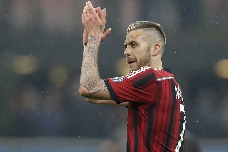 AC Milan's Jeremy Menez celebrates at the end of the Serie A soccer match between AC Milan and Cagliari at the San Siro stadium in Milan, Italy, Saturday, March 21, 2015. AC Milan won 3-1.(AP Photo/Antonio Calanni)