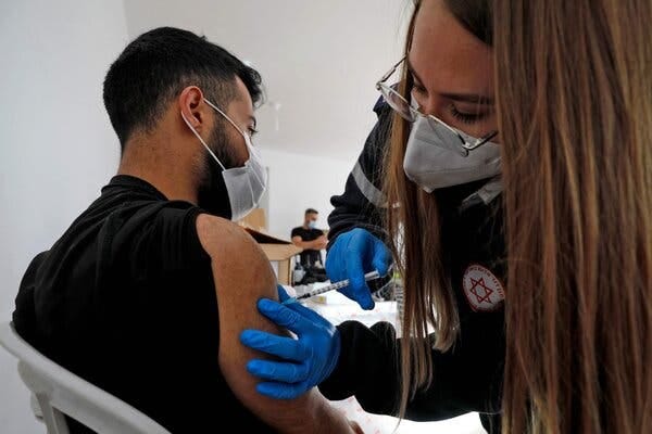 Administering a dose of the Pfizer-BioNtech vaccine at a mobile clinic near Moshav Dalton in northern Israel in February.