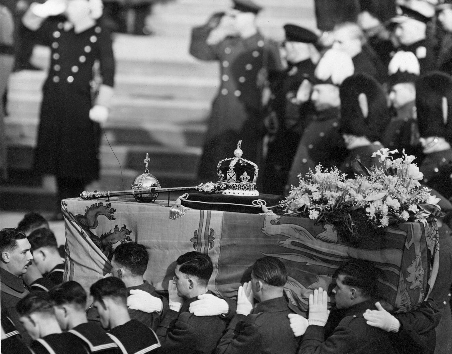 The coffin of George VI  draped with the royal standard being carried by soldiers on Feb. 15, 1952. (George W. Hales—Getty Images)