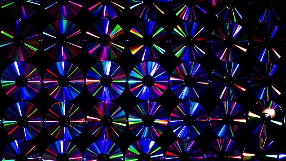 A collection of CDs on a black background